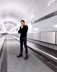 Full length of man standing in tunnel