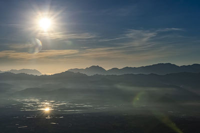 Scenic view of mountains against sky during sunset