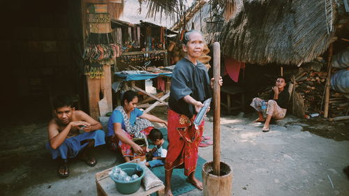 People in traditional clothing standing outdoors