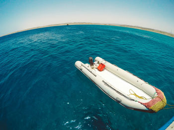 High angle view of motorboat moored on sea