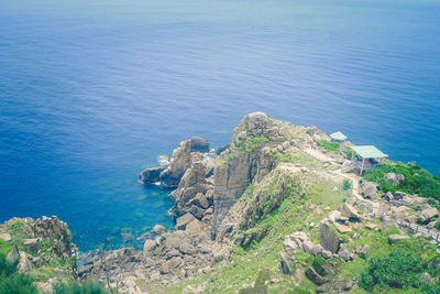 High angle view of rocks by sea