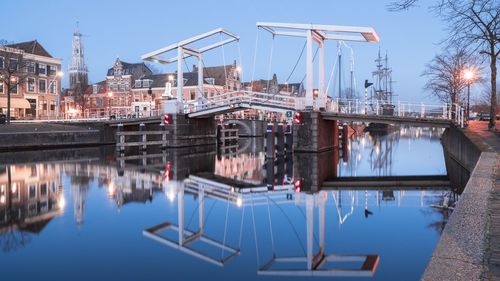 View of boats moored at harbor during winter