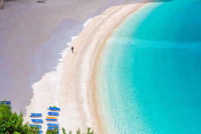 Aerial view of beach and buildings against sky