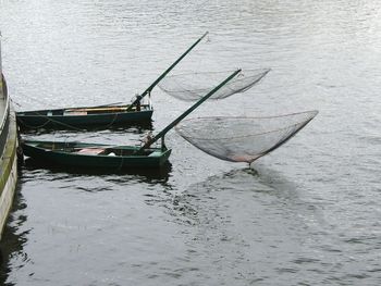 Boats moored on sea