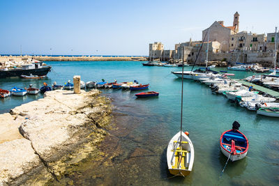 Colorful boats at giovinazzo port, apulia, italy