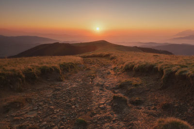 Scenic view of landscape against sky during sunset