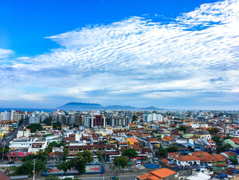 High angle view of townscape against blue sky