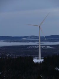 Wind turbines on field