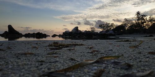 Scenic view of rocks against sky during sunset