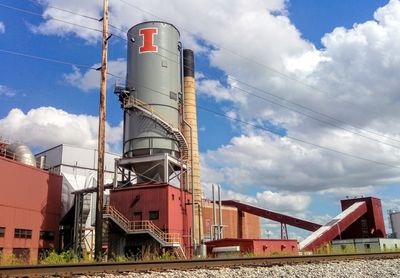 Low angle view of factory against sky