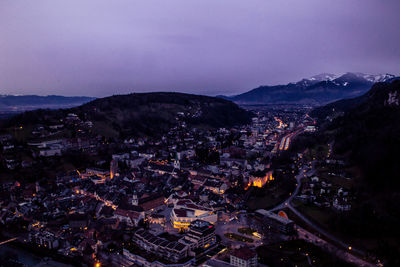 High angle view of illuminated cityscape at dusk