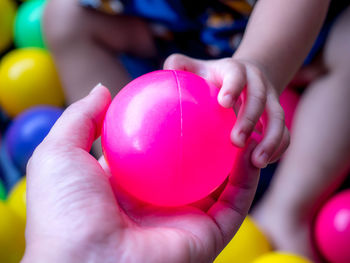 Close-up of hands holding ball