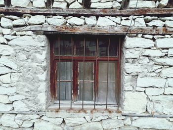 Close-up of window on brick wall