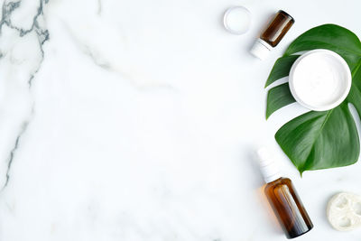 High angle view of bottles on white background