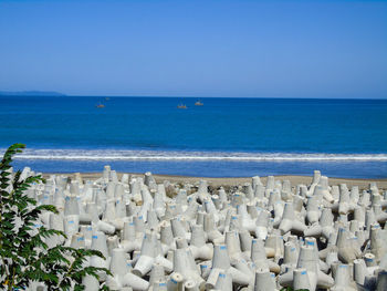 Scenic view of sea against clear blue sky