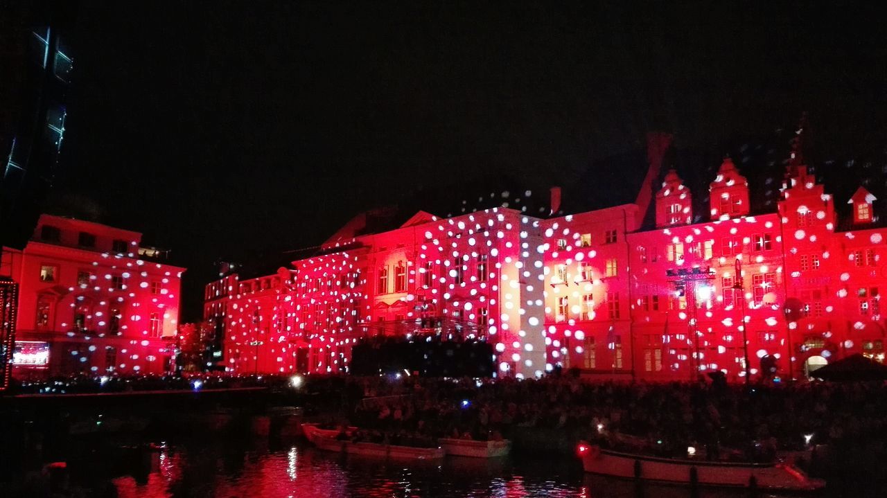 LOW ANGLE VIEW OF ILLUMINATED BUILDINGS