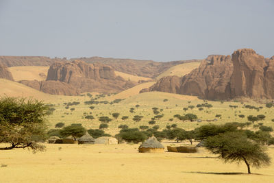 Scenic view of landscape and mountains against sky