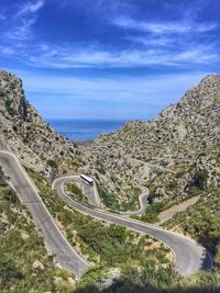 High angle view of road amidst mountains against sky