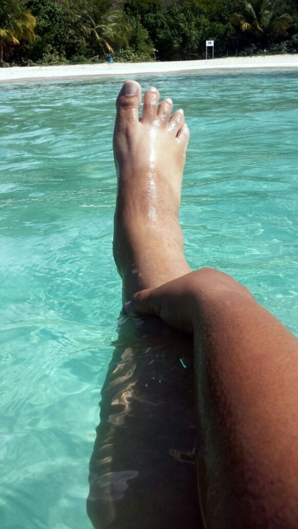 water, low section, person, barefoot, lifestyles, relaxation, leisure activity, swimming pool, sea, human foot, vacations, blue, sunlight, personal perspective, resting, relaxing