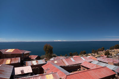 High angle view of townscape against blue sky