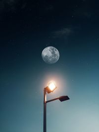 Low angle view of moon against sky at night