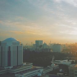 Cityscape against sky during sunset