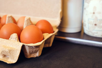 Close-up of eggs in container on table