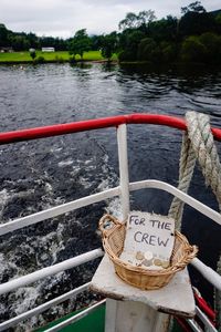 High angle view of rope tied to boat moored at riverbank