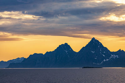 Seascape view at a mountainous coast landscape in sunset