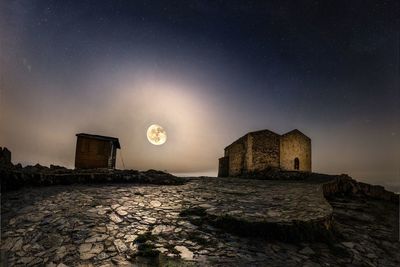 Old building against sky at night