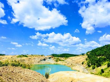 Scenic view of landscape and lake against sky