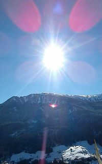 Scenic view of snow mountains against sky