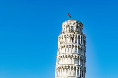 Low angle view of tower against blue sky