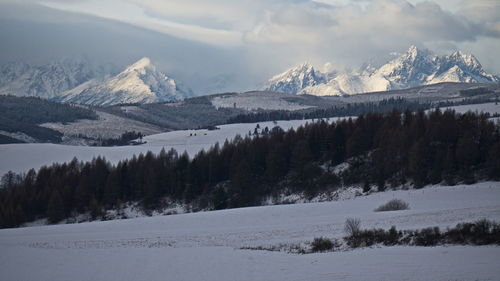 Scenic view of snowcapped mountains against sky