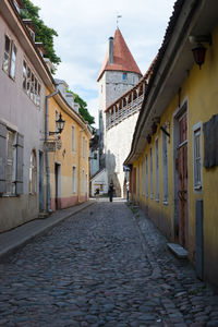 Alley amidst buildings in city