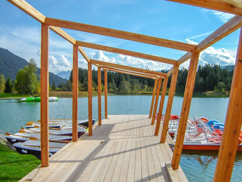 Pier over lake against sky