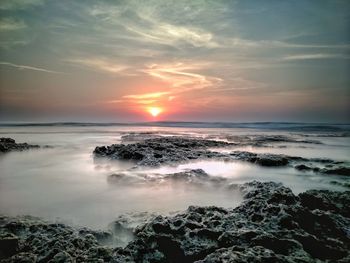 Scenic view of sea against sky during sunset