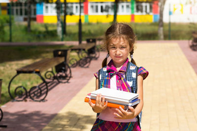 Portrait of girl standing outdoors