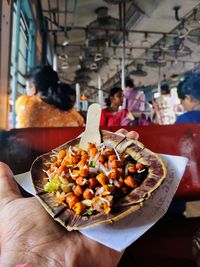 Close-up of hand holding food