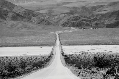 Empty road along landscape