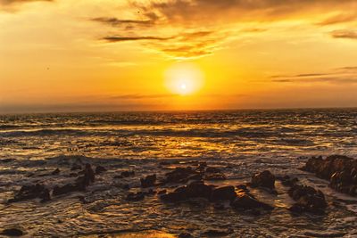 Scenic view of sea against sky during sunset