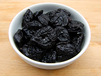 High angle view of black tea in bowl on table