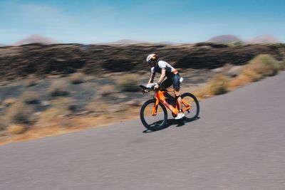 Man riding motorcycle on road