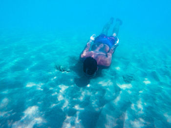 High angle view of man swimming in sea