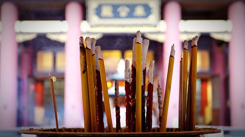 Close-up of lit incense sticks at che kung temple