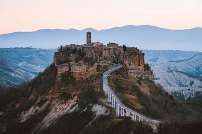 Castle on mountain against sky