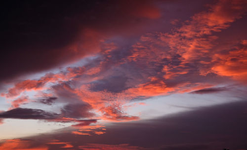 Low angle view of dramatic sky during sunset