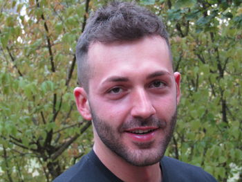 Close-up portrait of smiling young man