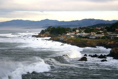 Scenic view of sea against cloudy sky
