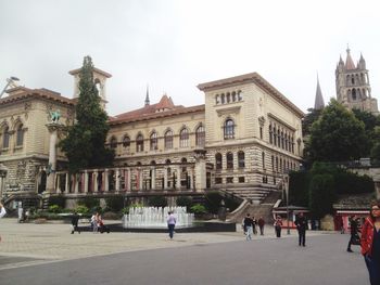 Tourists in front of historical building